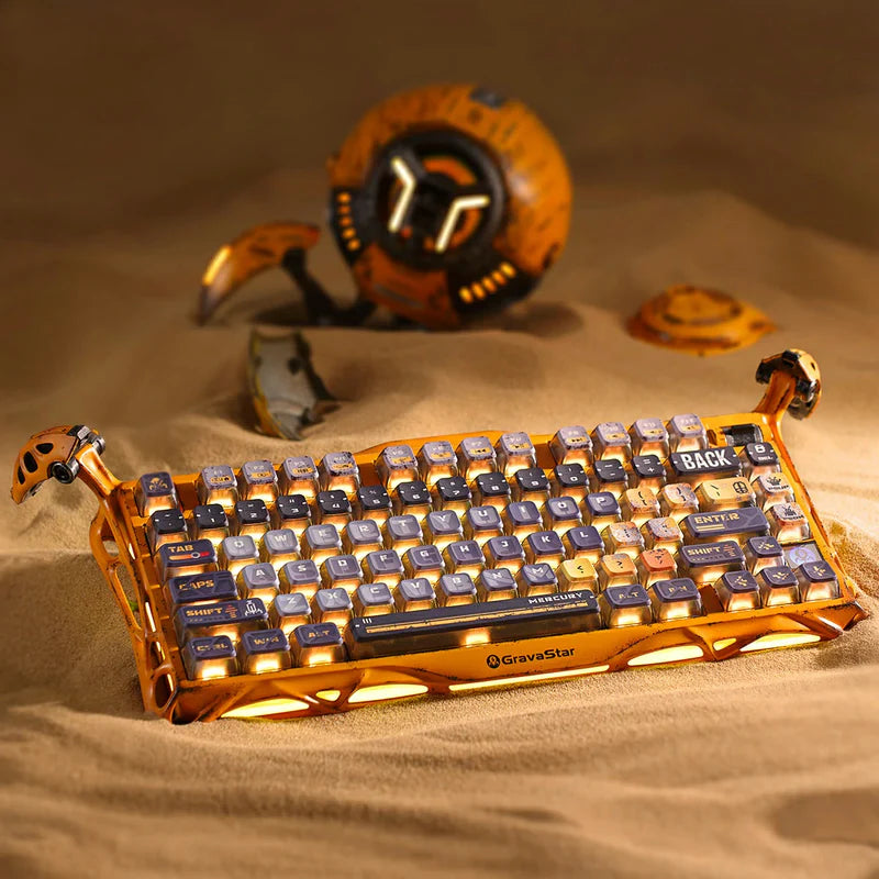 GravaStar Handcrafted Gaming Set in Battle-Worn Yellow, showcasing Mercury K1 Pro Special Edition and Mercury X Pro Special Edition gaming peripherals—each with a unique one-of-a-kind handcrafted aluminum alloy frame featuring Battle-Worn-inspired aesthetics. Includes a free GravaStar Keyboard Wrist Rest Pad (worth $12.95). Highlighted features: 75% compact layout for space-saving, dynamic RGB lighting (16.8M colors, 13 modes with South-facing key backlighting), premium build with 70M keystroke-rated switch